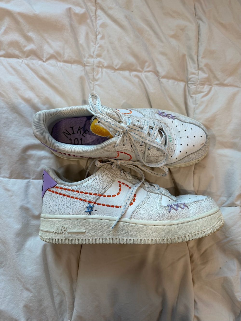 Nike White Sneakers with Purple Heel and Orange Stitching